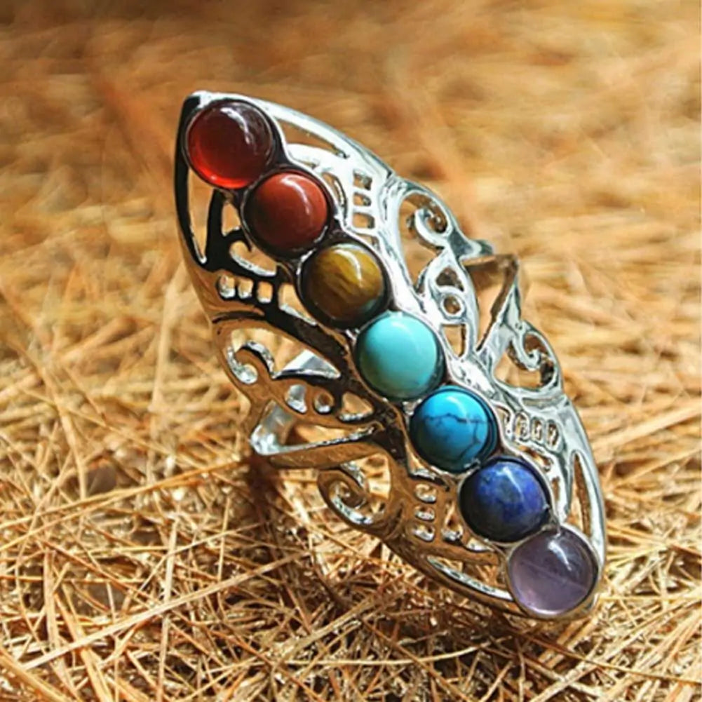 Balance Your Energy:  Harmonize your mind, body, and spirit with our Chakra Healing Ring. Designed with seven vibrant stones, each representing a different chakra, it helps restore balance and promote positive energy flow throughout your body.  Handcrafte